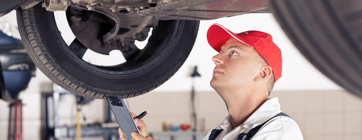 technician checking a vehicle - MOT Poole